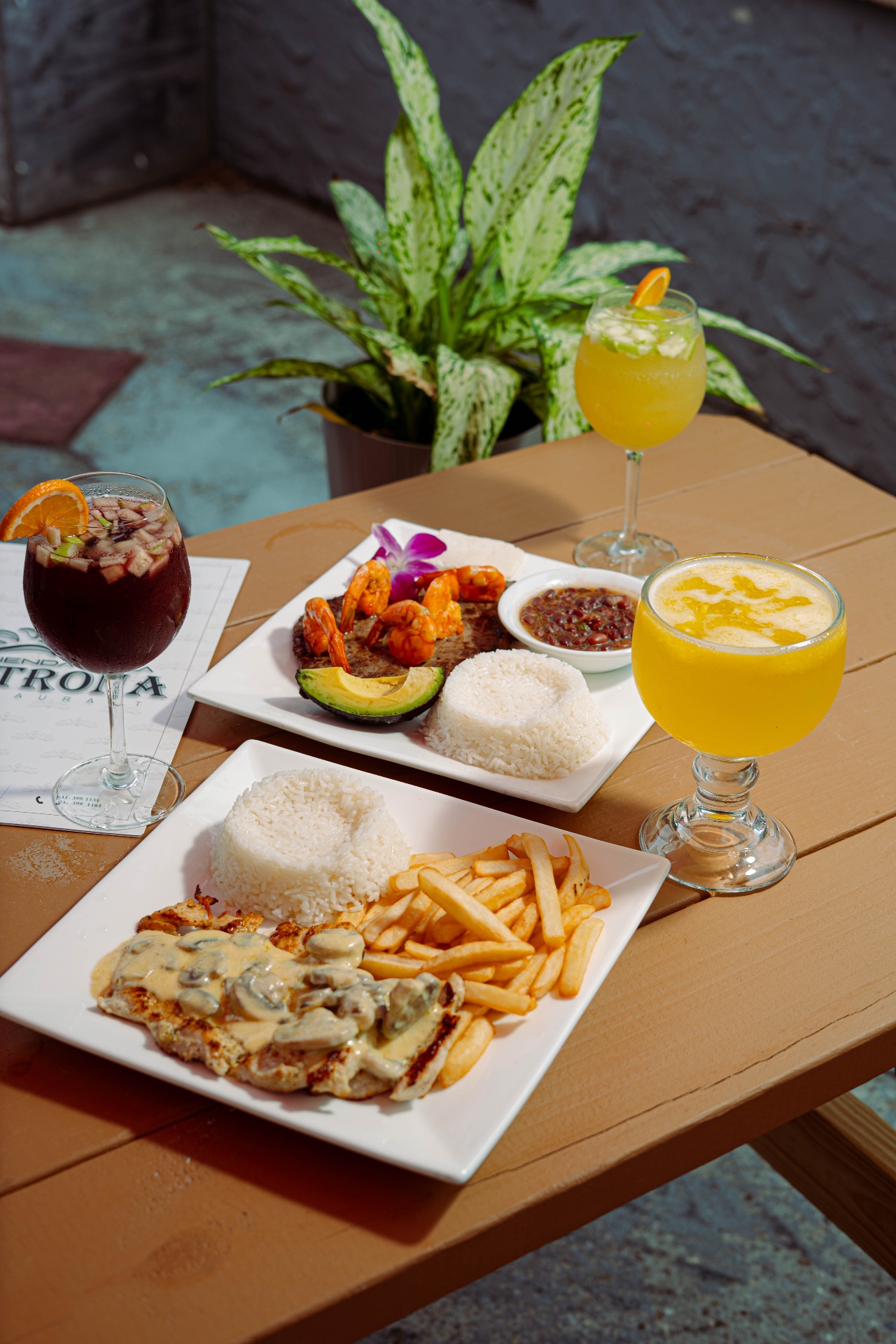 Table with steak and cocktails