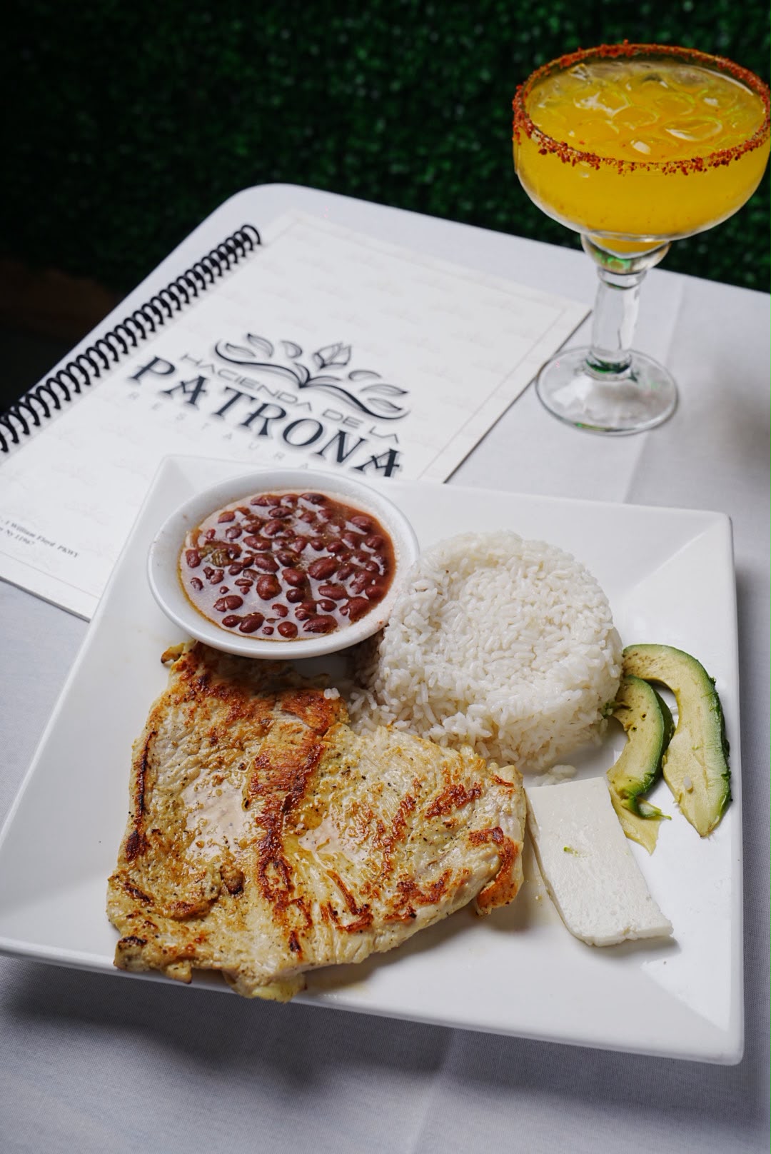 Grilled chicken with rice, beans and mango margarita